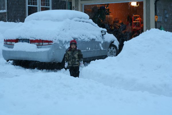 Caleb beside the car